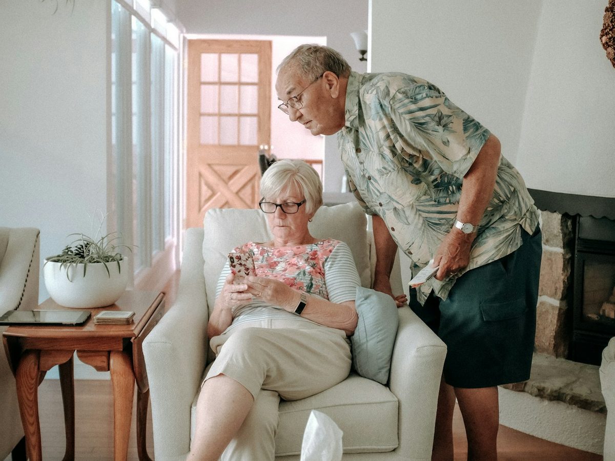 An older couple at home in their living room